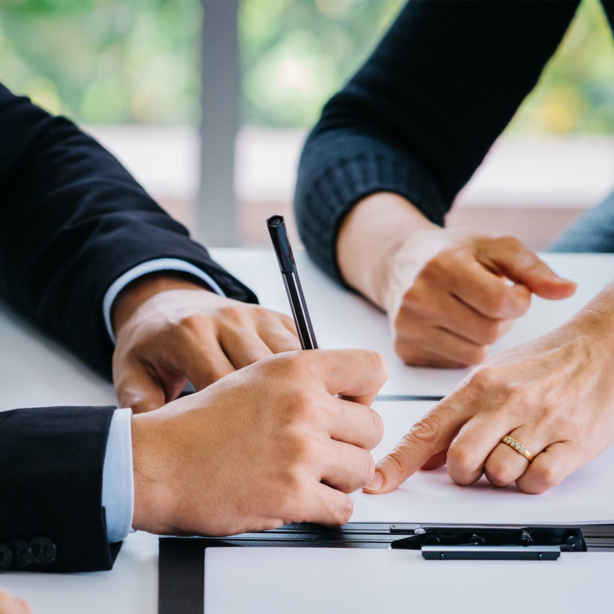 Couple filing divorce papers in their lawyer’s office