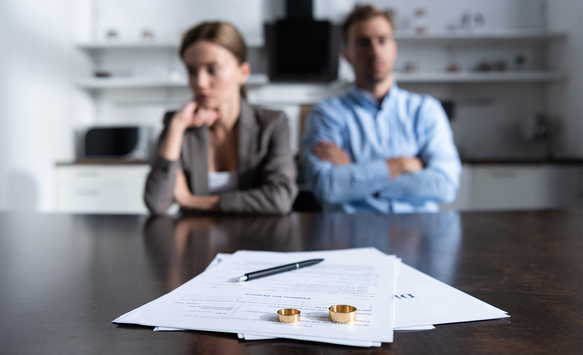 Man and woman filing for divorce in Canada through their lawyers